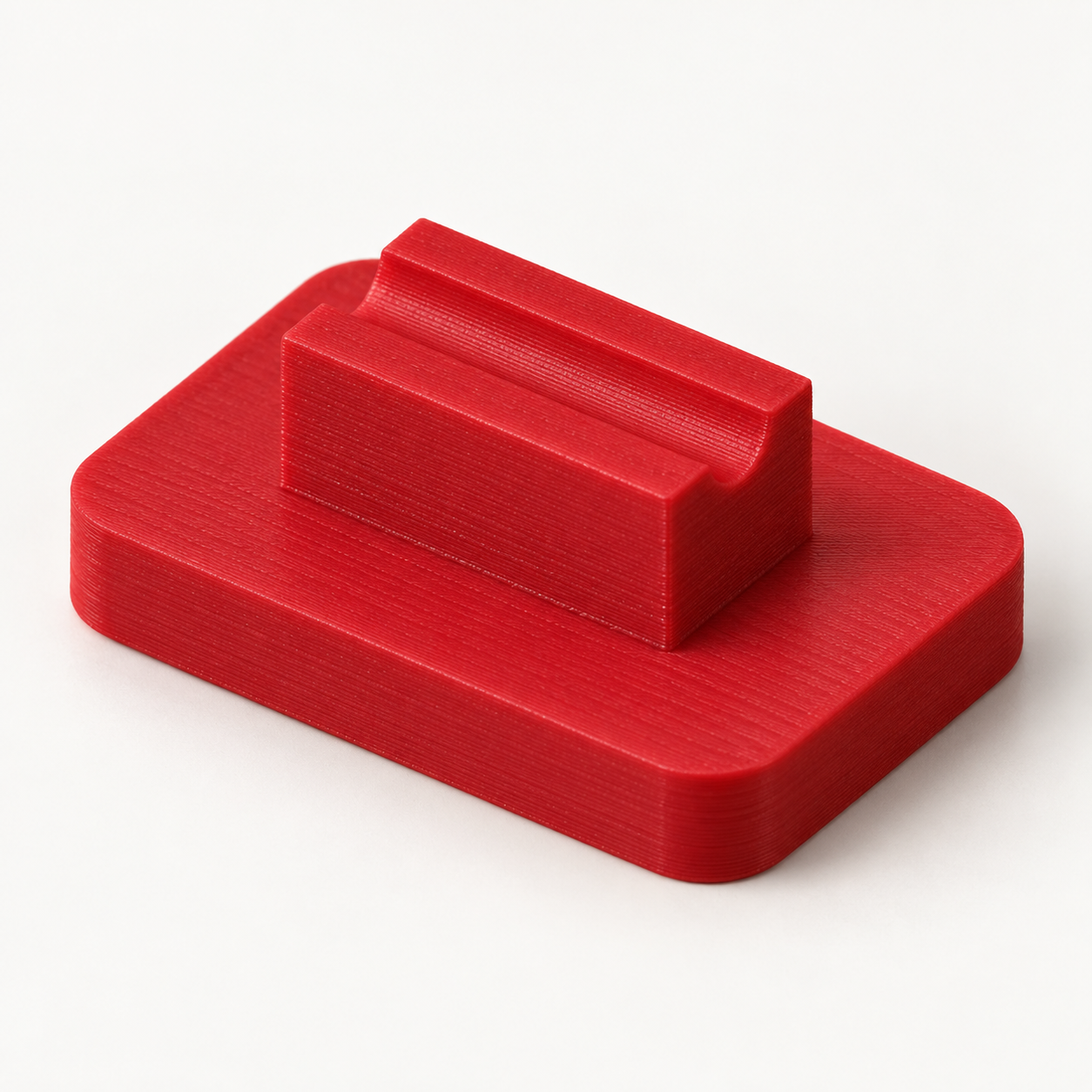 Biegeklotz für axiale Bauteildrähte mit eigenem Raster – rot. KI-Visualisierung der Standardmaße.